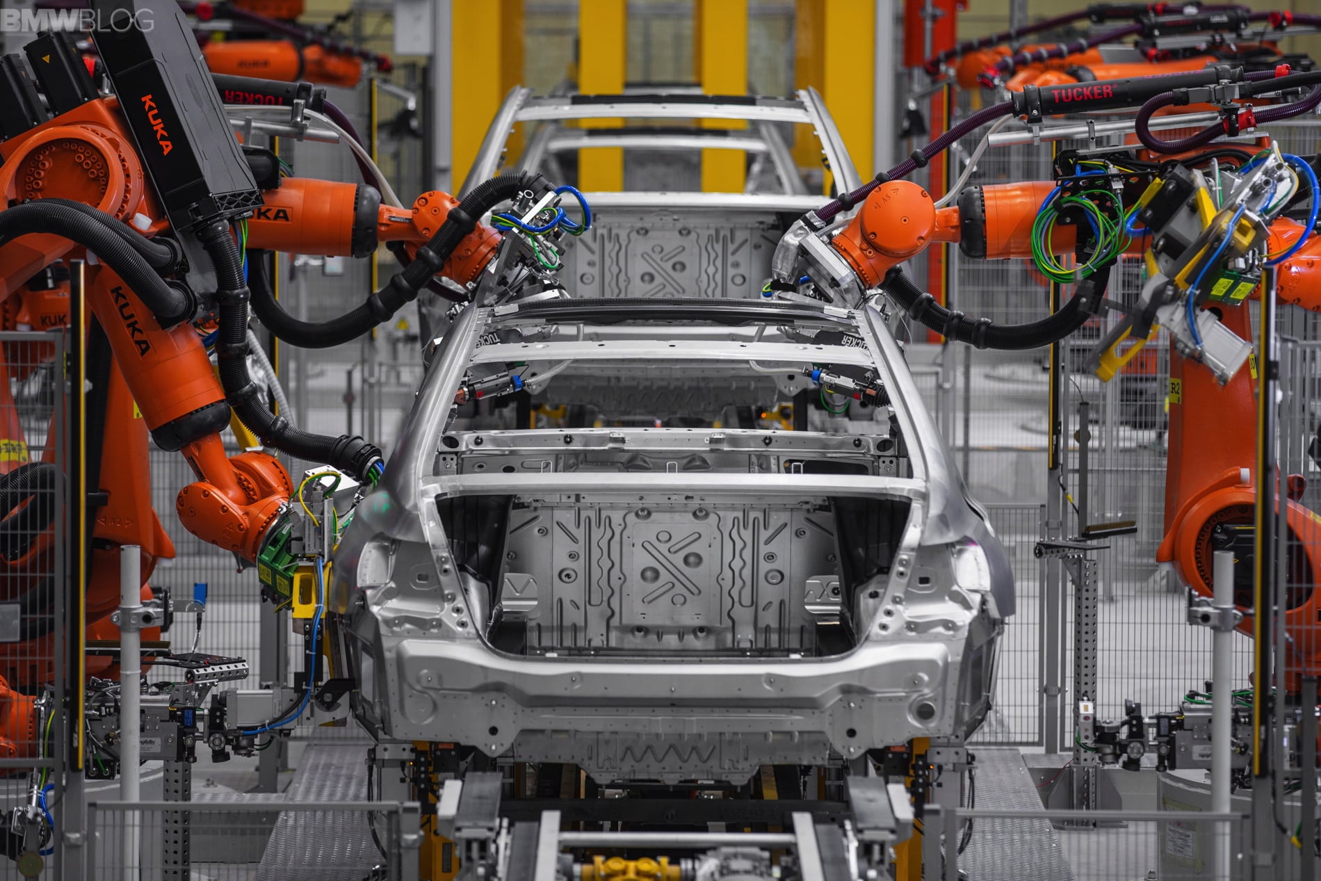 BMW 7 Series in production at a manufacturing plant, showcasing advanced assembly processes and vehicle body structure
